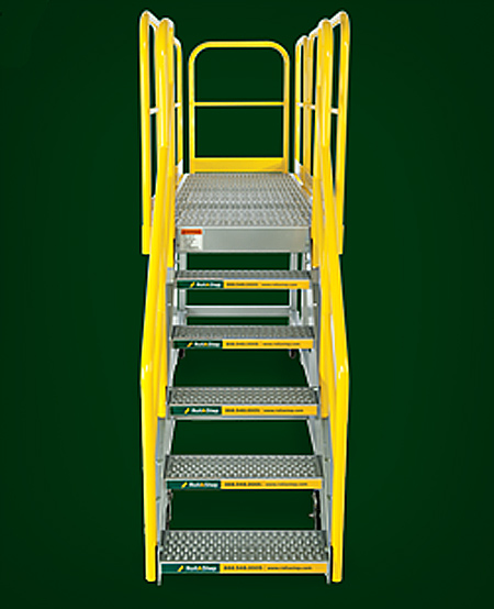 View of mobile work platform from stair end, showing no-slip self-draining surfaces on tread and deck, along with OSHA compliant removable safety handrail